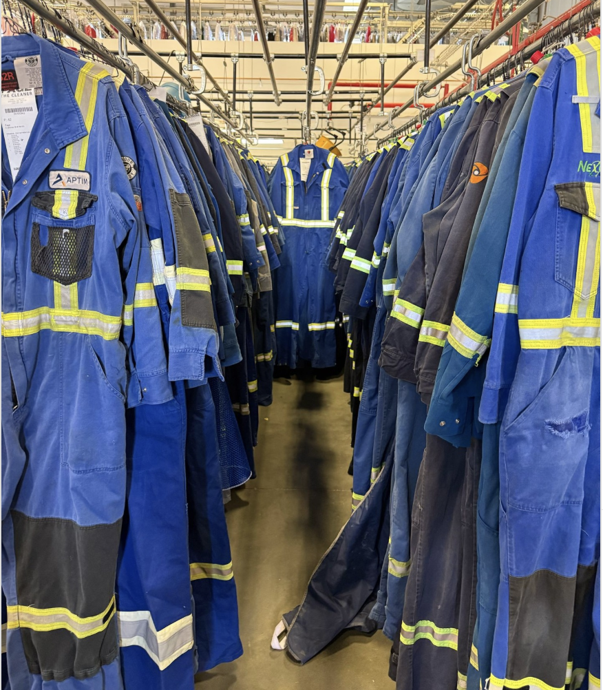 Coveralls hanging in a row